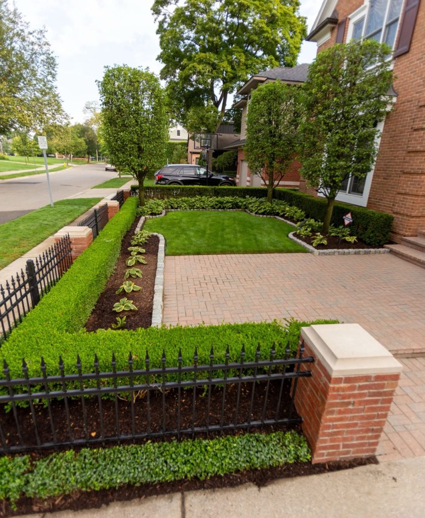 A custom brick paver patio featured in our landscape design portfolio.
