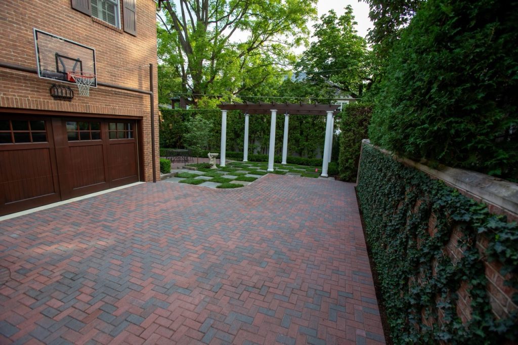 A custom brick paver patio featured in our landscape design portfolio.