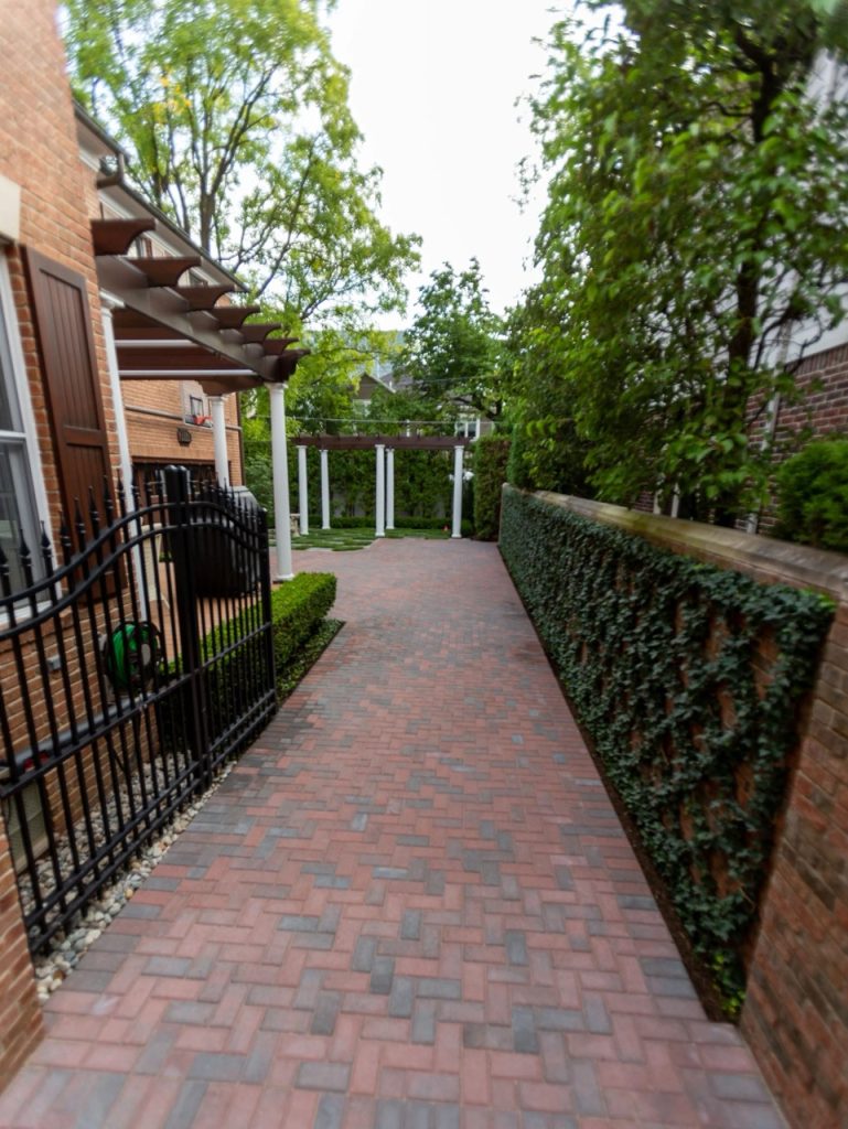 A custom brick paver patio featured in our landscape design portfolio.